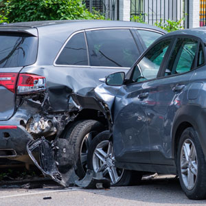 Severe car collision on the road, emphasizing legal support for accident victims. 